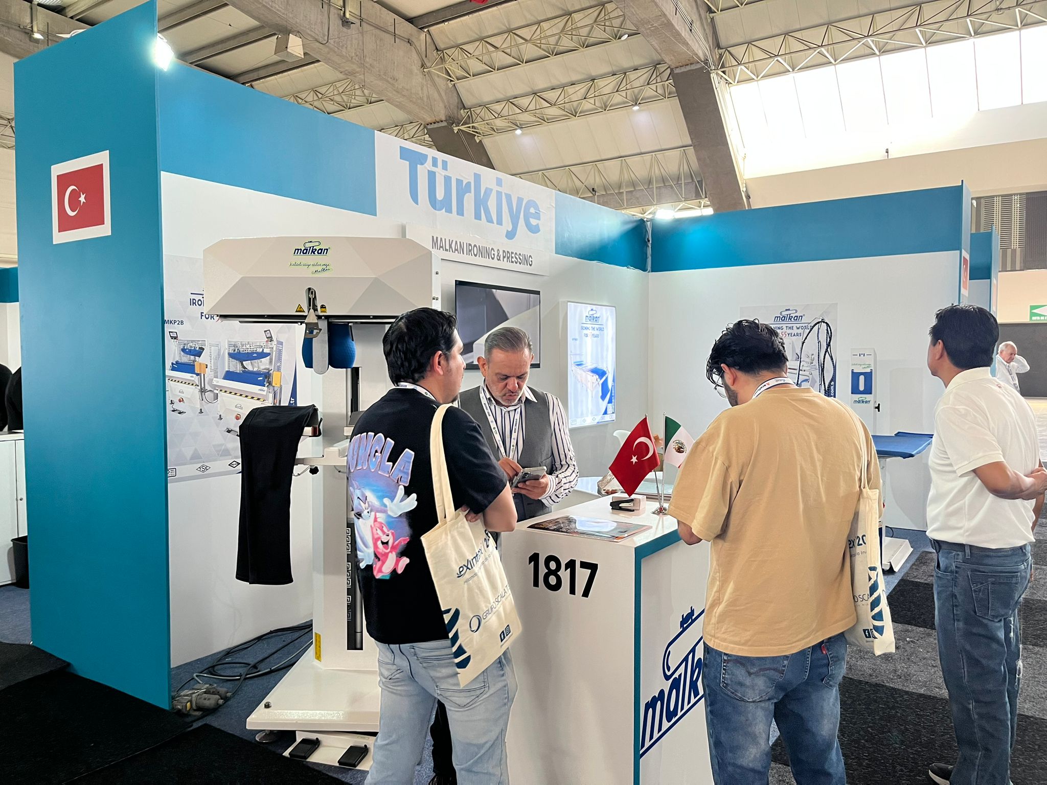 Malkan at Exintex 2026 exhibition stand showcasing advanced AI-powered ironing technologies and automated garment finishing systems