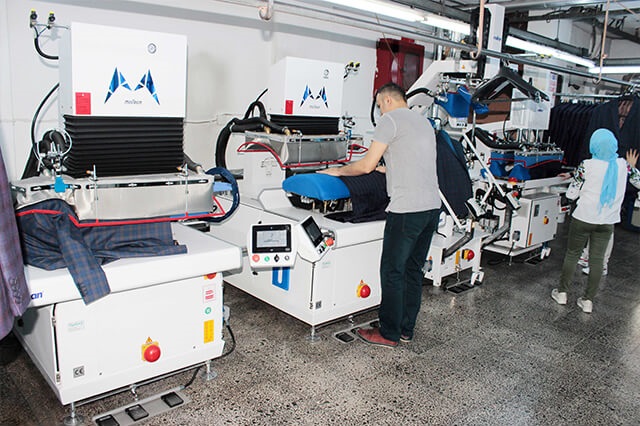 Jacket final ironing quality control and pressing application on the Mensar apparel production line with Malkan Ironing Equipment 2016.